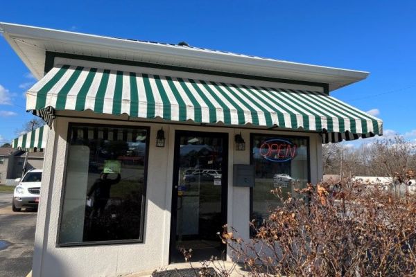 Striped fabric entryway awning 