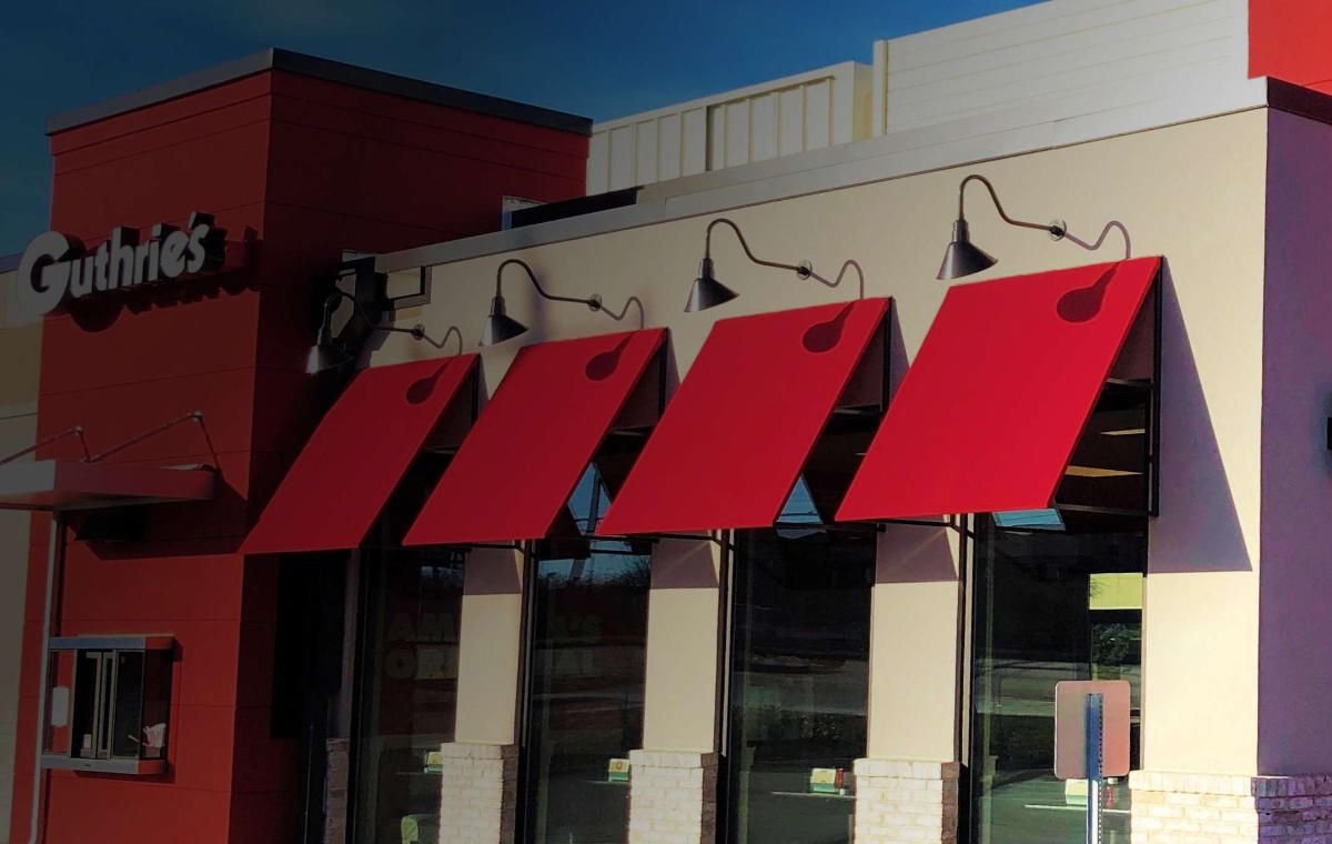 Venetian style awnings are a popular style for resturants and boutiques.