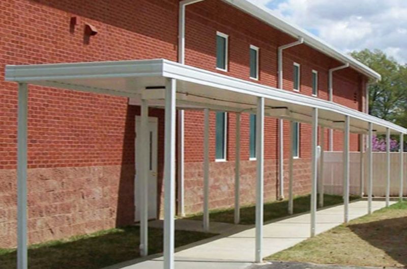 Roll form fascia on metal canopy with posts