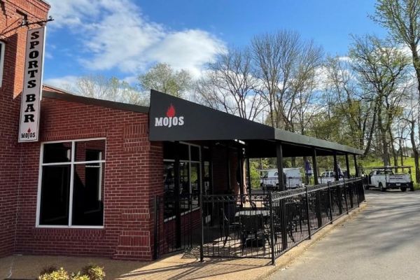 Fabric canopy over outdoor dining patio